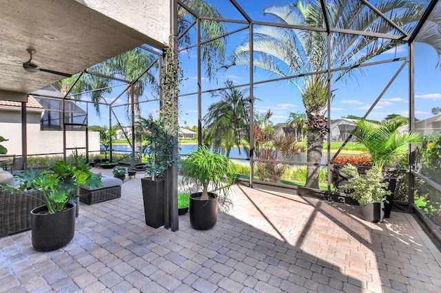 view of patio / terrace with glass enclosure and ceiling fan