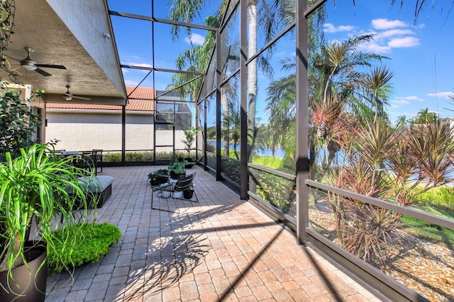 sunroom featuring ceiling fan