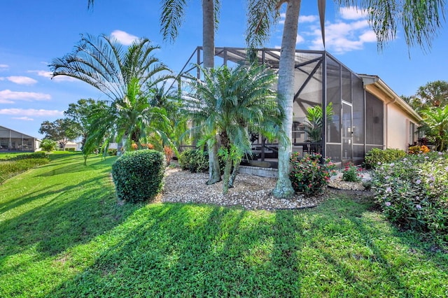 view of yard with glass enclosure