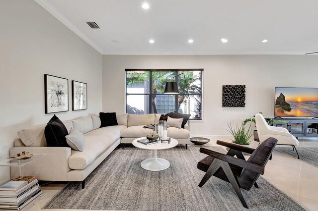 living room featuring crown molding and light tile patterned floors