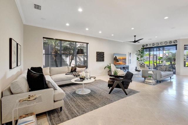 tiled living room with ceiling fan