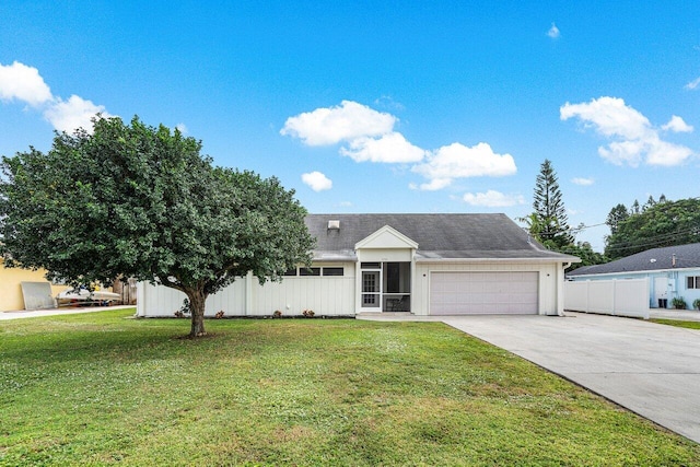 view of front facade with a front yard and a garage