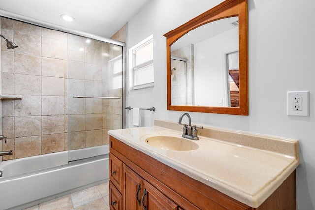 bathroom featuring vanity and bath / shower combo with glass door