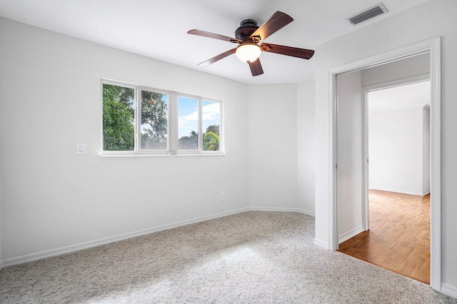 unfurnished room with ceiling fan and hardwood / wood-style floors