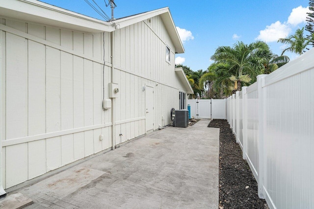 view of property exterior with a patio area and central air condition unit