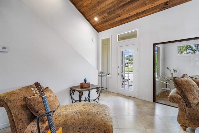 foyer with high vaulted ceiling and wood ceiling