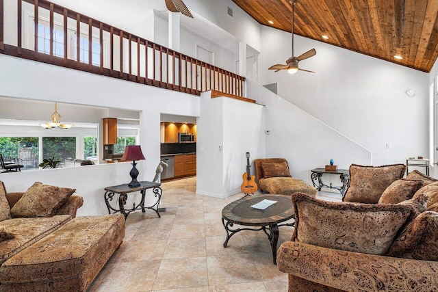 living room featuring ceiling fan with notable chandelier, wooden ceiling, and high vaulted ceiling