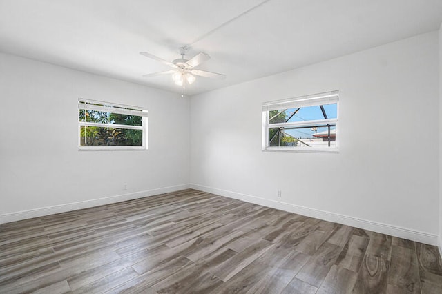 unfurnished room featuring ceiling fan and hardwood / wood-style flooring