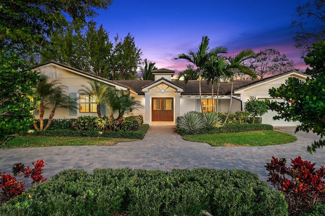 single story home with a garage