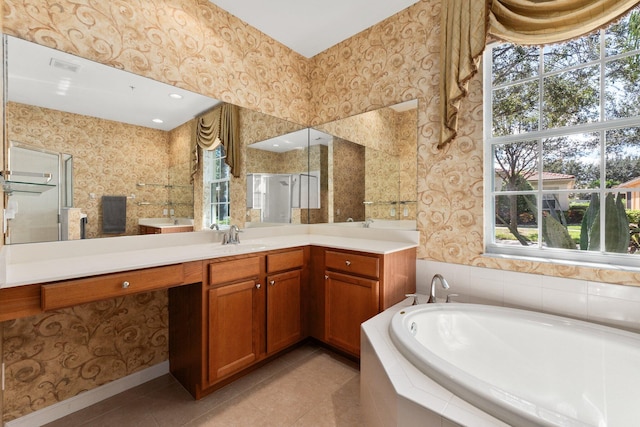 bathroom featuring vanity, independent shower and bath, tile patterned flooring, and plenty of natural light