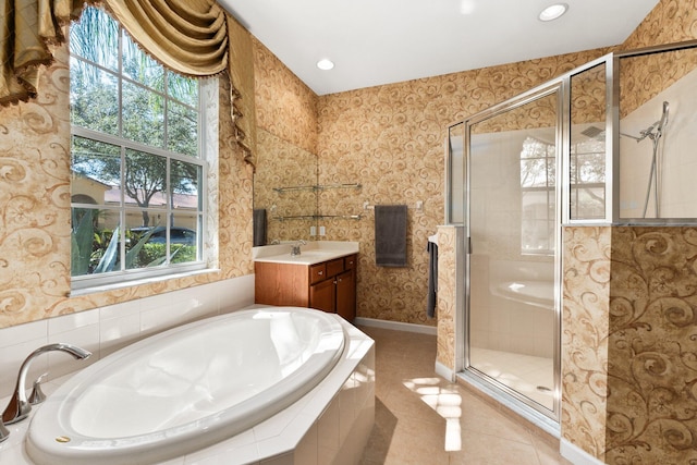 bathroom featuring vanity, plus walk in shower, lofted ceiling, and tile patterned flooring