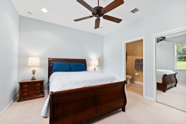 carpeted bedroom featuring ensuite bathroom and ceiling fan