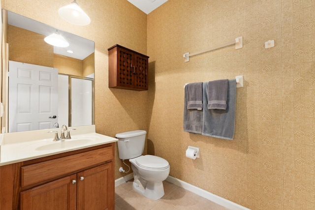 bathroom featuring tile patterned flooring, an enclosed shower, vanity, and toilet