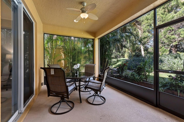 sunroom / solarium with ceiling fan