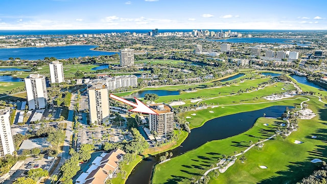 birds eye view of property featuring a view of city, a water view, and golf course view