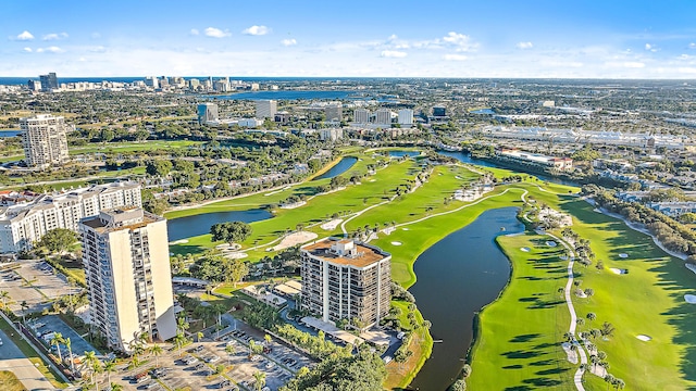 bird's eye view with a view of city, golf course view, and a water view