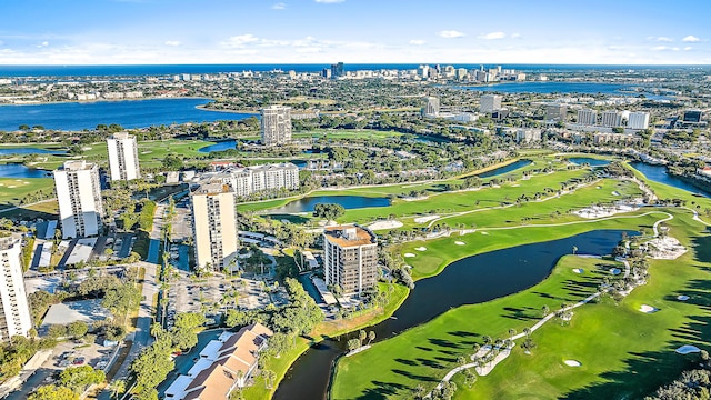 bird's eye view featuring a view of city, view of golf course, and a water view