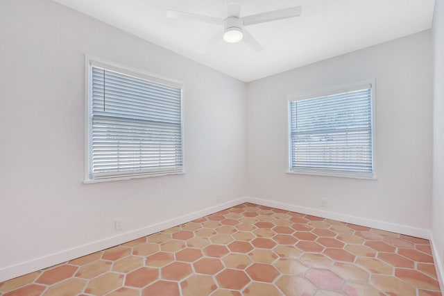 unfurnished room with ceiling fan