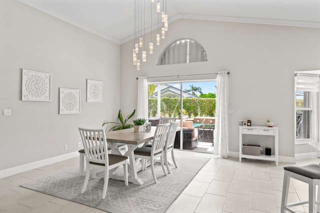 dining area featuring light tile patterned floors, high vaulted ceiling, and ornamental molding