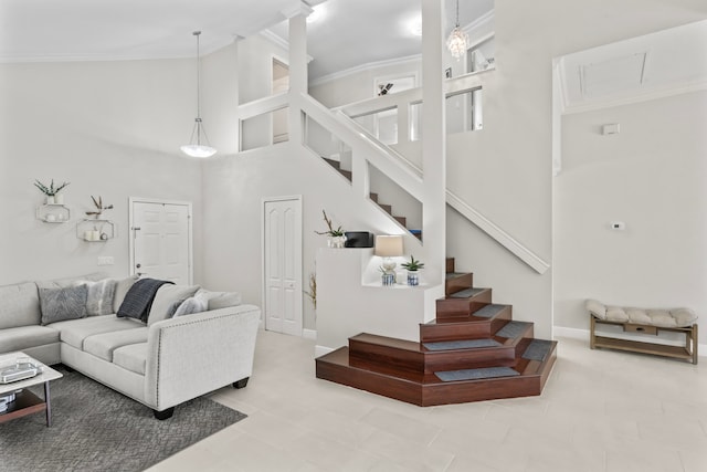 living room featuring light tile patterned floors, high vaulted ceiling, and ornamental molding