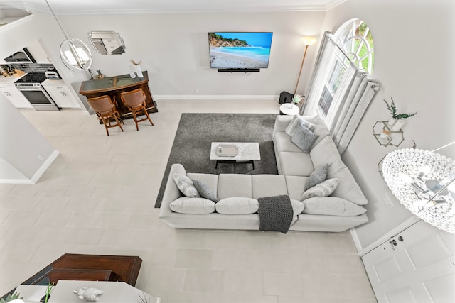 tiled living room featuring crown molding