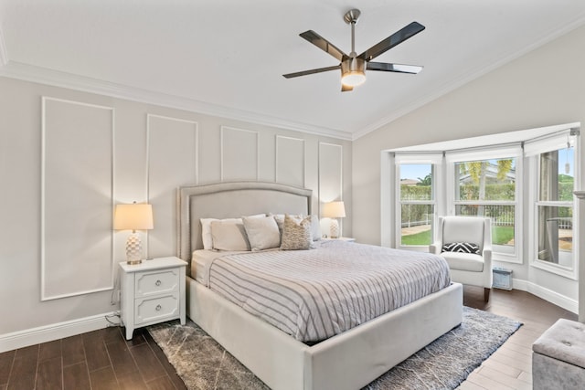 bedroom with ceiling fan, dark hardwood / wood-style flooring, crown molding, and vaulted ceiling