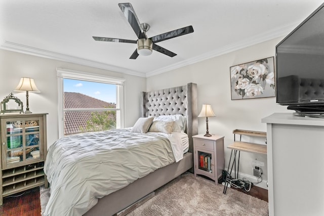 bedroom with ceiling fan and crown molding