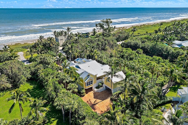 aerial view with a water view and a beach view