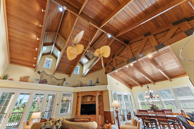 living room with high vaulted ceiling, a notable chandelier, wood ceiling, beam ceiling, and french doors