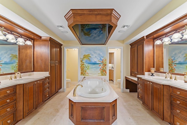 bathroom featuring a tub to relax in, vanity, and toilet