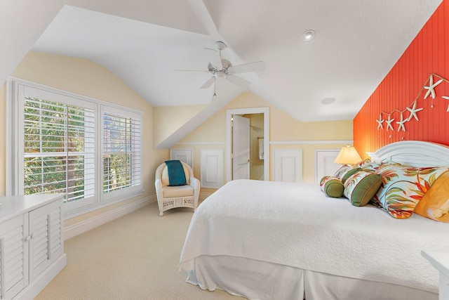 carpeted bedroom featuring vaulted ceiling and ceiling fan