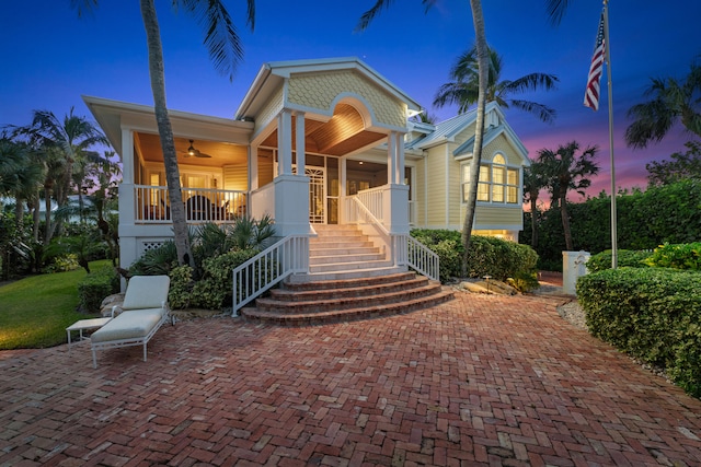 view of front of house with ceiling fan and covered porch