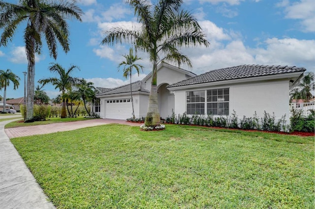 view of front facade featuring a garage and a front lawn