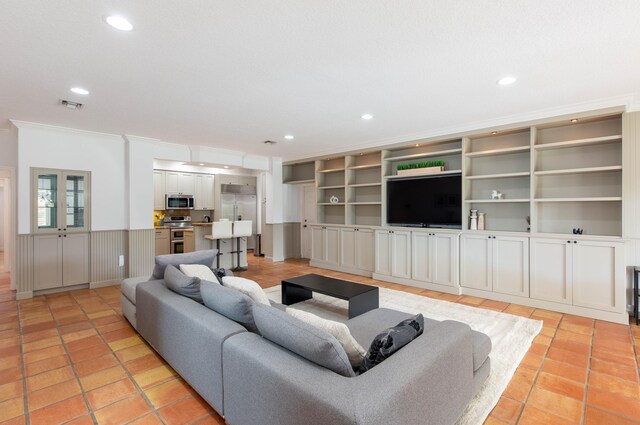 tiled living room featuring crown molding