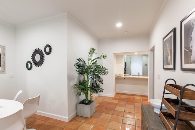 bathroom with vanity, tile patterned floors, and crown molding