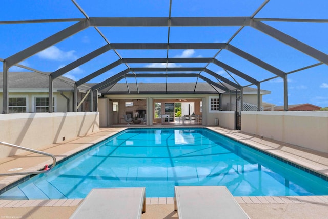 view of pool with a lanai and a patio area