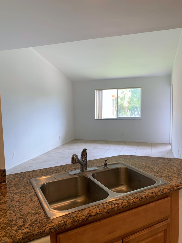 kitchen with light tile patterned flooring and sink