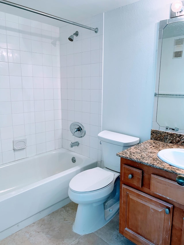 full bathroom featuring vanity, toilet, and tiled shower / bath