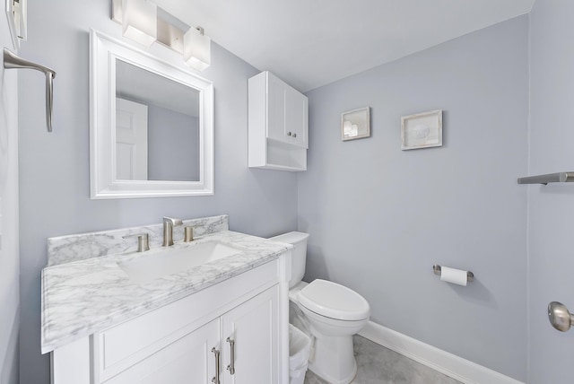 bathroom with toilet and vanity