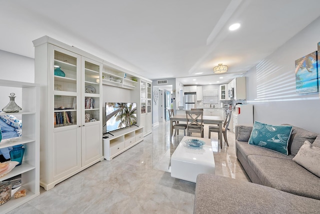 living room featuring built in shelves