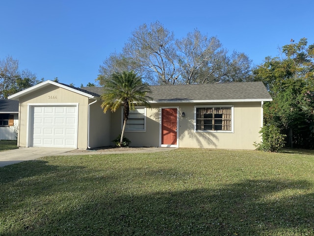 single story home featuring a garage and a front lawn