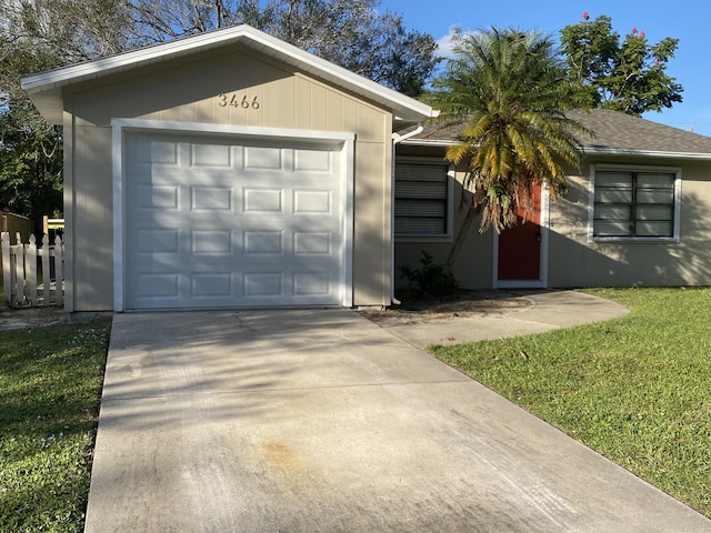 ranch-style house with a front lawn and a garage