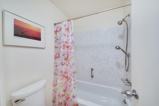 bathroom featuring shower / tub combo with curtain and toilet