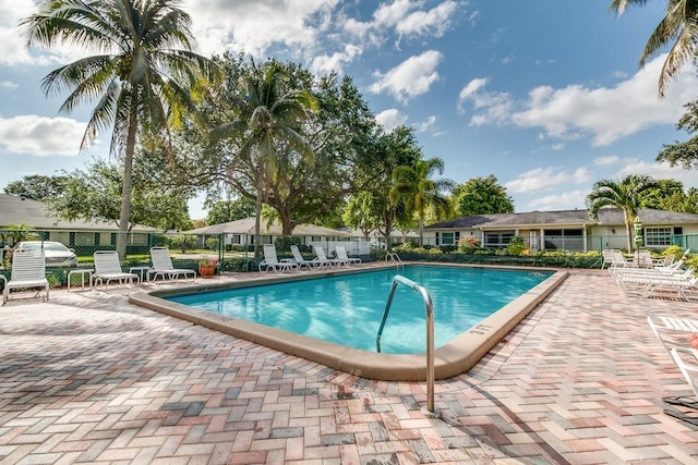 view of swimming pool with a patio