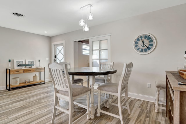 dining room featuring light hardwood / wood-style flooring