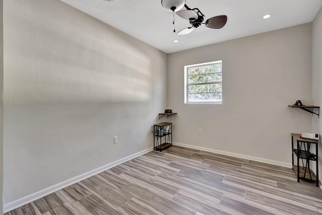spare room with ceiling fan, baseboards, recessed lighting, and wood finished floors