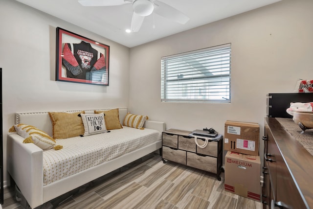 bedroom with light hardwood / wood-style floors and ceiling fan