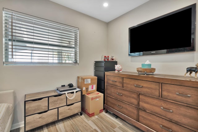bedroom featuring light wood-style floors and recessed lighting