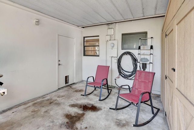 sitting room featuring unfinished concrete flooring