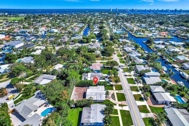 aerial overview of property's location featuring a large body of water and nearby suburban area
